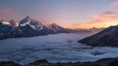 Person meditating at sunrise with calm morning light